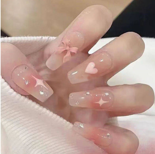Artistic Nail Art with Glitter and Flower Applications Bowlift