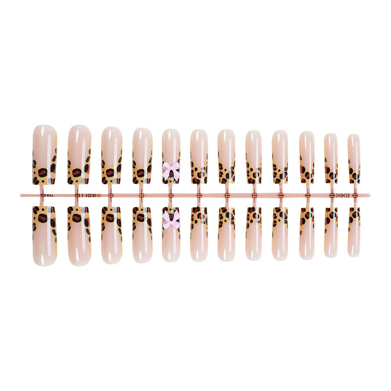 Decorative Stiletto Press-On Nail Art with Animal Print and Bow Accents Bowlift