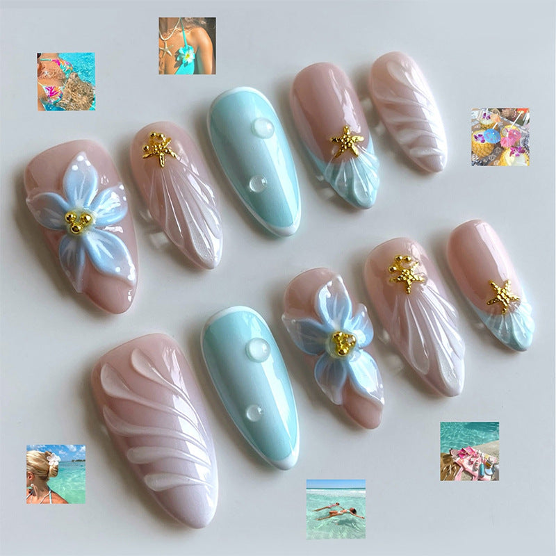 Artificial nail set with floral design and artistic embellishments Bowlift