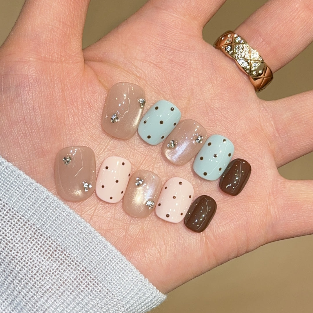 Acrylic nails with rhinestones and glitter Bowlift