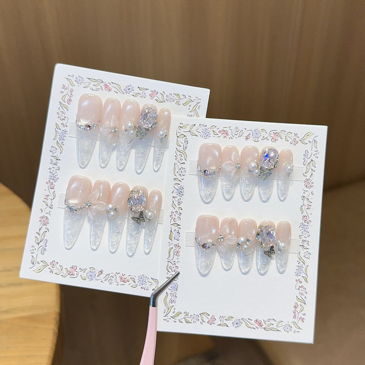 Artificial nails with delicate glitter and pearl decoration Bowlift
