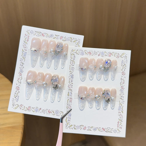 Artificial nails with delicate glitter and pearl decoration Bowlift