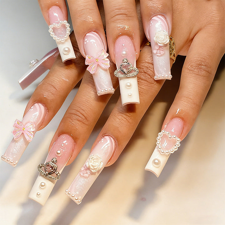 Artful nail tips with pearl and bow motifs Bowlift