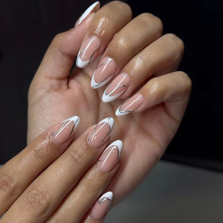 Elegant artificial nails with fine wave and glitter motifs Bowlift