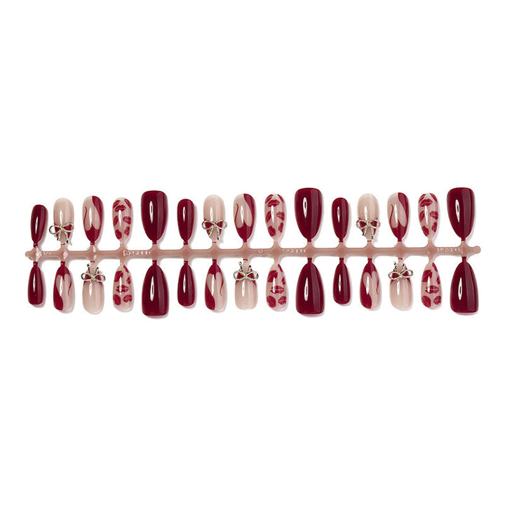 Artificial nail set with elegant bow and lip designs Bowlift