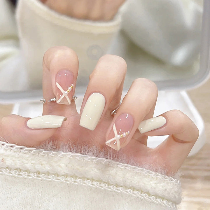 Acrylic nail set with elegant and playful design Bowlift