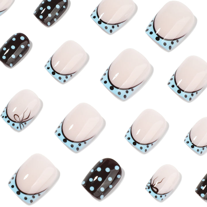 Artful nail extensions with playful dots and elegant design Bowlift