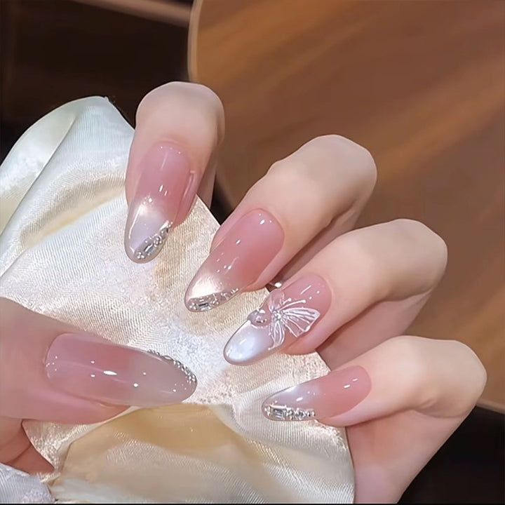 Acrylic nail set with elegant ombre design and sparkling accents Bowlift
