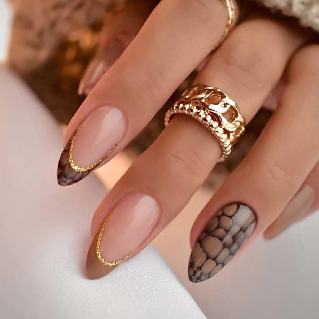 Artful stiletto nails with elegant gold decoration Bowlift