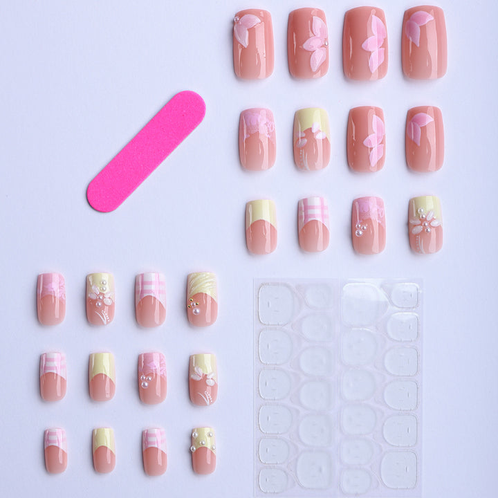 Artificial nails with creative floral designs and glitter accents Bowlift
