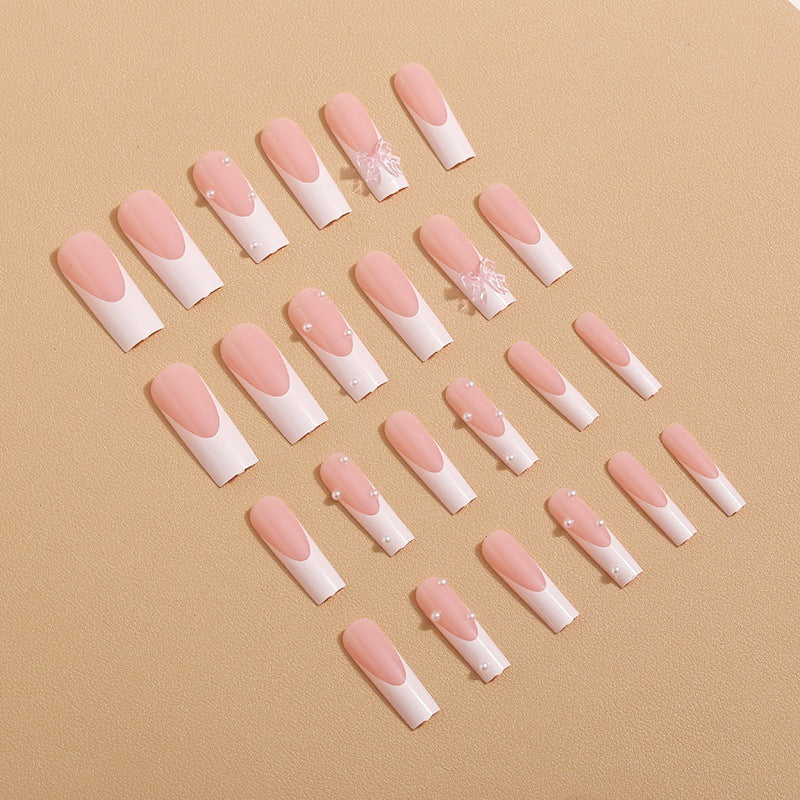Artistic nail extensions with pearls and bows decorations Bowlift