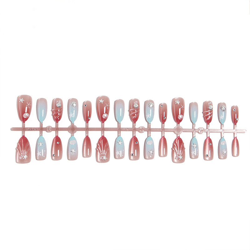 Artificial nails with sparkling rhinestone embellishments and maritime design Bowlift