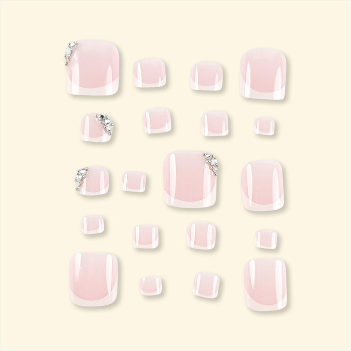 Artificial nail set with elegant French manicure and glitter accents Bowlift