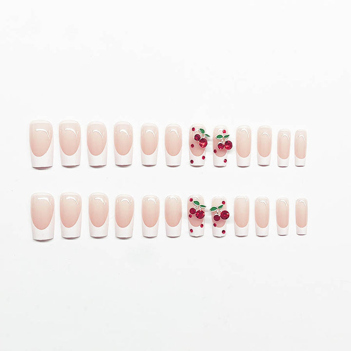 Acrylic nail set with chic cherry motifs and elegant French tip Bowlift