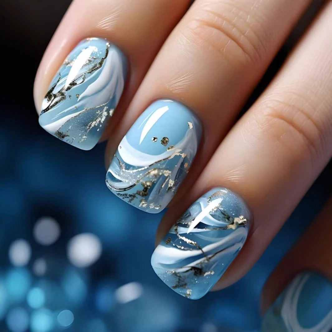 Acrylic nail set with luxurious marble design and gold accents Bowlift