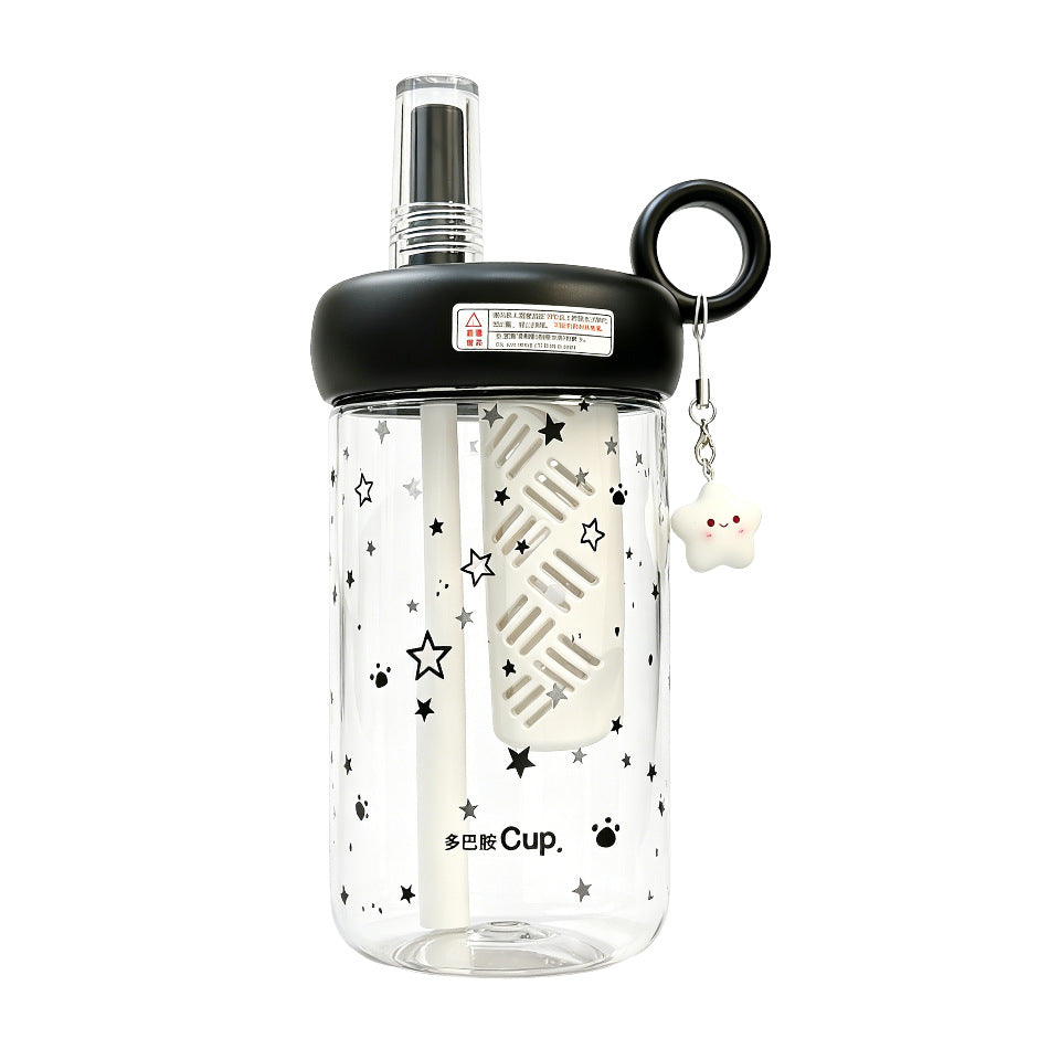 Women’s drinking bottle with integrated fruit filter and charming pendant Bowlift