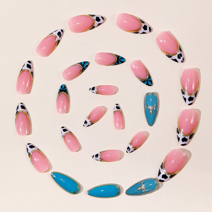 Artistic Stiletto Nail Art Extensions with Cow Print and Gold Accents Bowlift