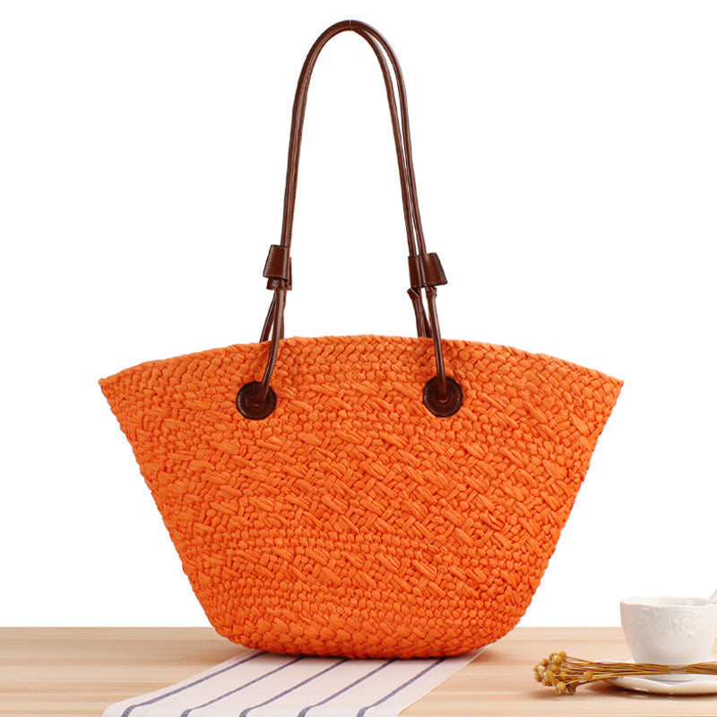 Beach bag made of high-quality braided straw with stylish leather handles Bowlift