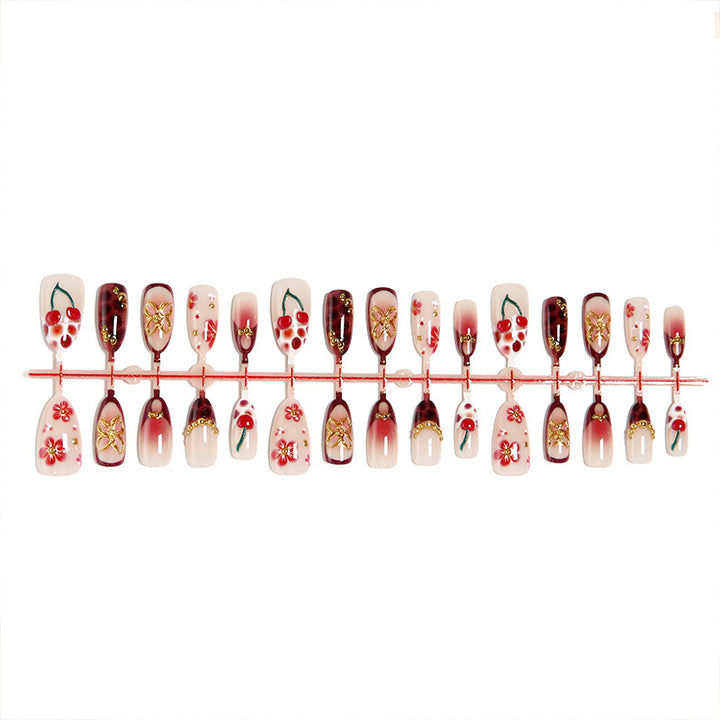 Artful nail tips with cheerful flower and cherry design Bowlift