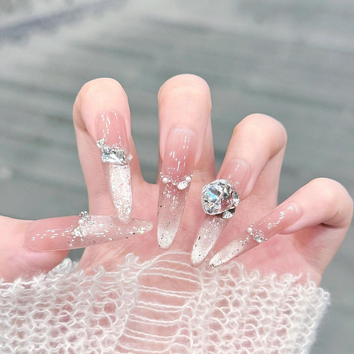 Artificial nails with glitter and crystal embellishments Bowlift
