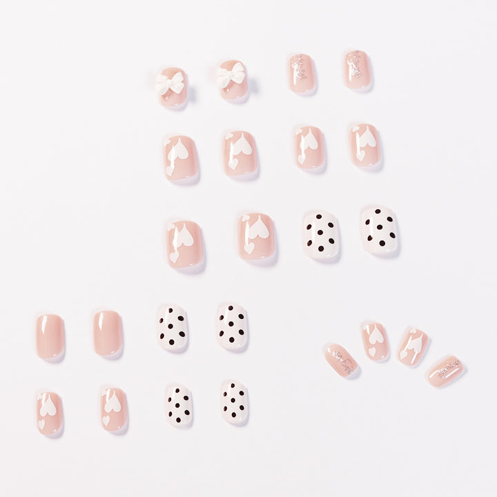 Artful nail art with delicate flower and heart motifs Bowlift