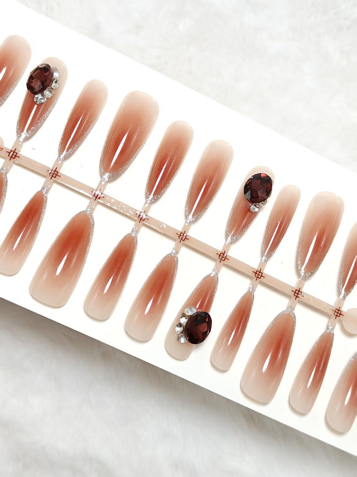 Glamorous artificial nails in elegant ombre style with rhinestone embellishments Bowlift
