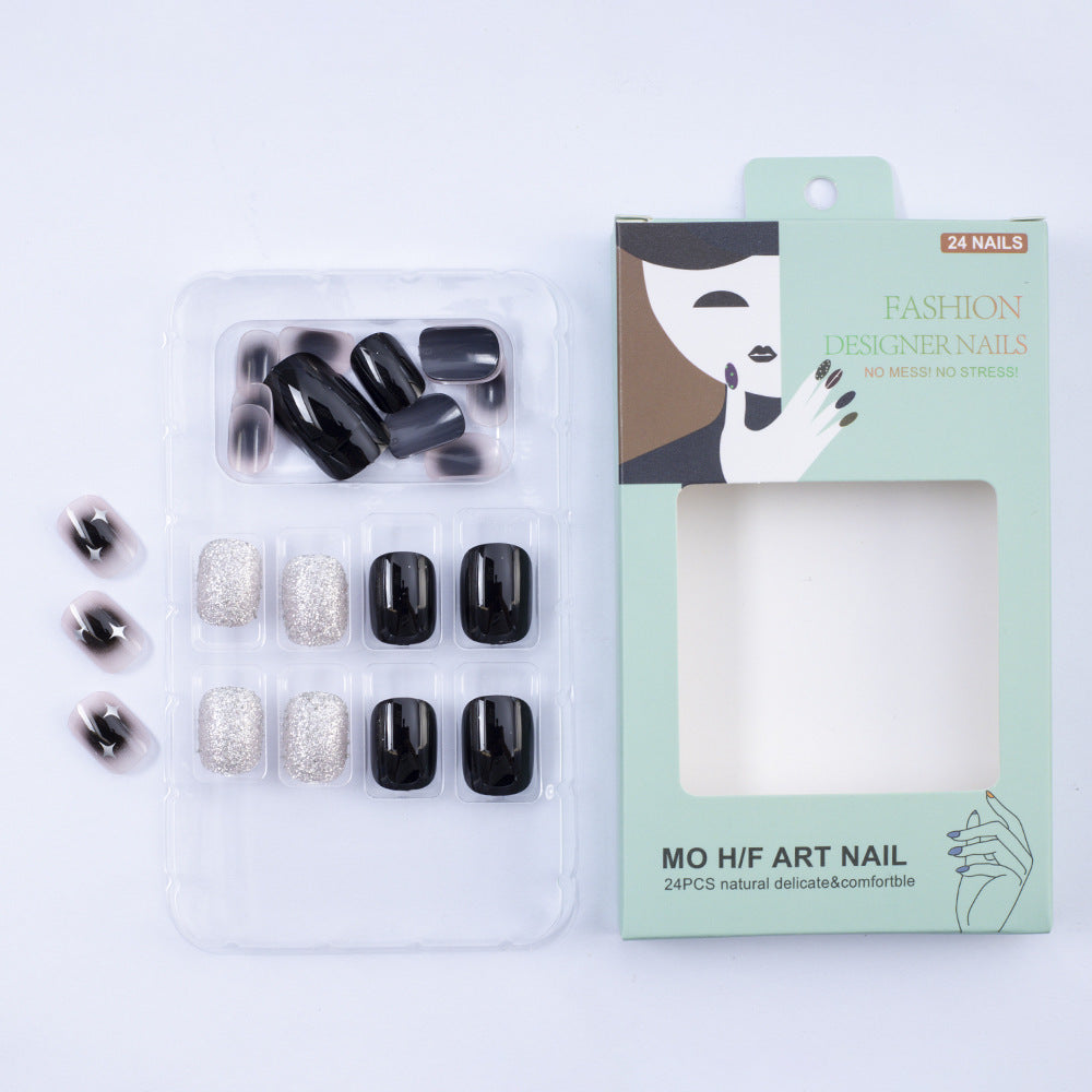 Artificial nails in elegant black with gloss and creative accents Bowlift