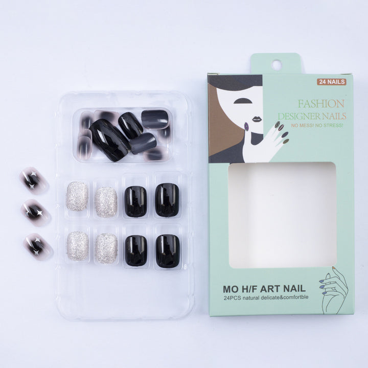 Artificial nails in elegant black with gloss and creative accents Bowlift