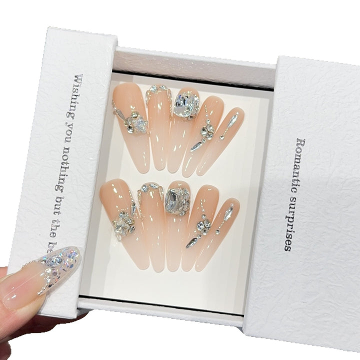 Artificial nails with exclusive rhinestone embellishments Bowlift