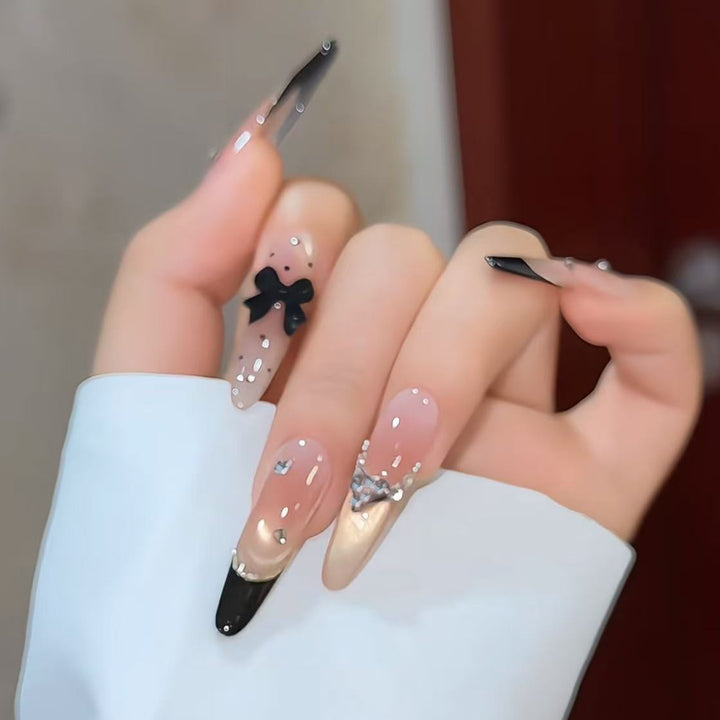 Artistic Stiletto Press-On Nail Art with Glimmering Accents Bowlift