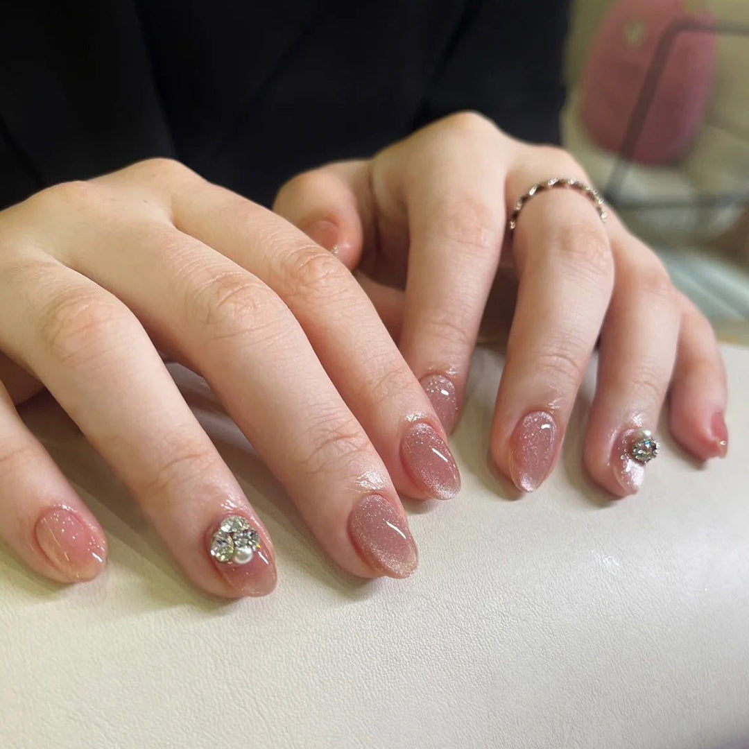Artful glitter nail extensions with elegant rhinestone accents Bowlift