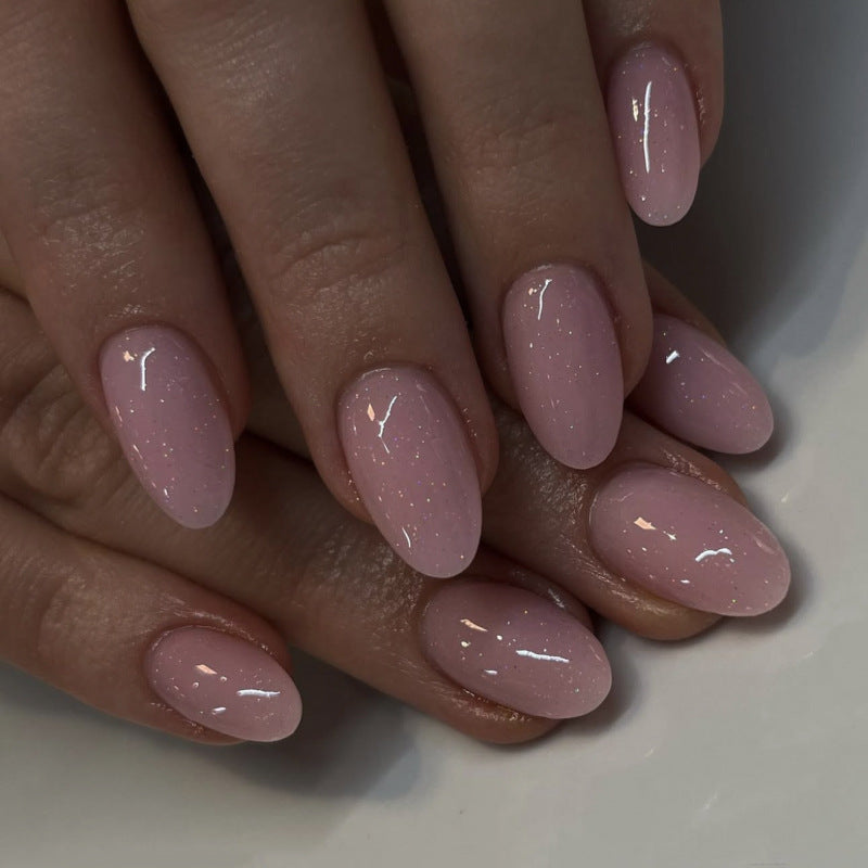 Artificial nail extensions with glitter accents Bowlift