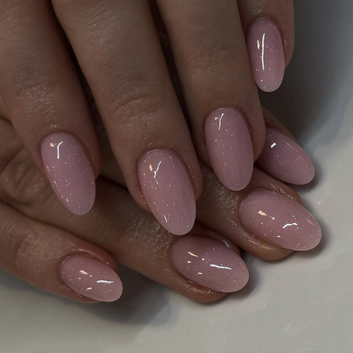 Artificial nail extensions with glitter accents Bowlift