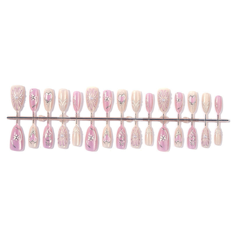 Acrylic nail set with floral accents and glitter embellishments Bowlift