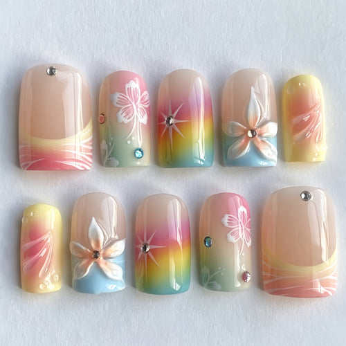 Acrylic nails with floral accents and gradient Bowlift