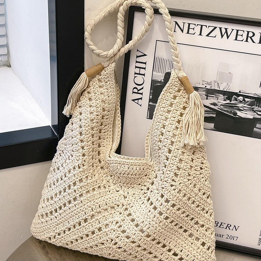 Hand-knotted shoulder bag with tassels and spacious interior Bowlift