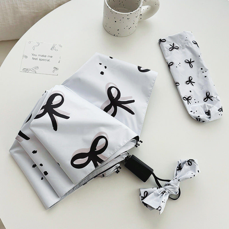 Women’s Folding Umbrella with Playful Bow Pattern Bowlift
