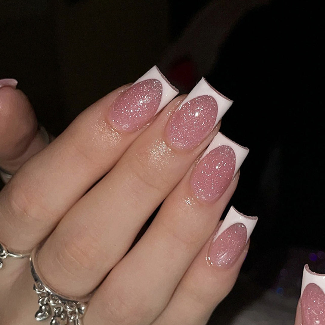 Artful nail decorations with glitter and French tip Bowlift