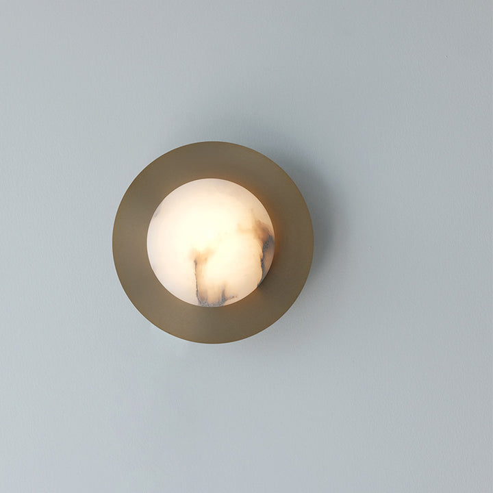 Contemporary alabaster globe wall sconce with round metal backplate Bowlift