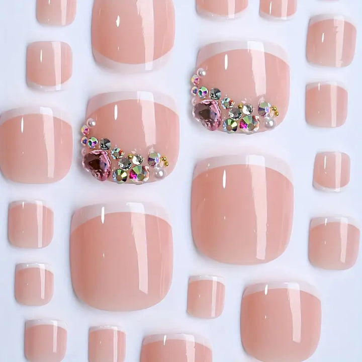 Artificial nail set with elegant French tips and glamorous crystal embellishments Bowlift