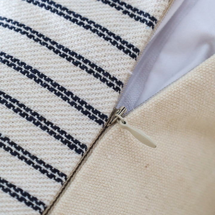 Square decorative pillow cover made of woven stripe pattern with two weaving directions and concealed zipper Bowlift