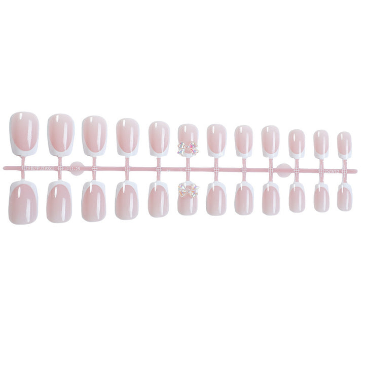 Elegant artificial nails with delicate glitter and decorative accents Bowlift
