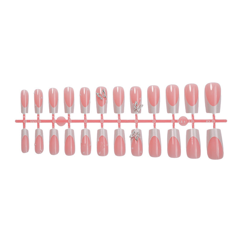 Nail art set with intricate designs and butterfly appliqués Bowlift