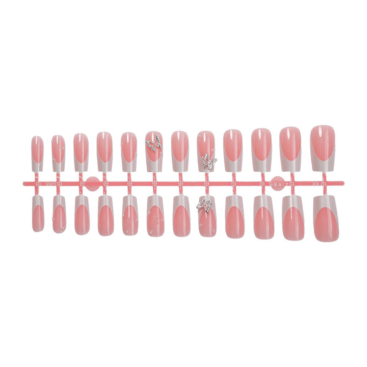 Nail art set with intricate designs and butterfly appliqués Bowlift