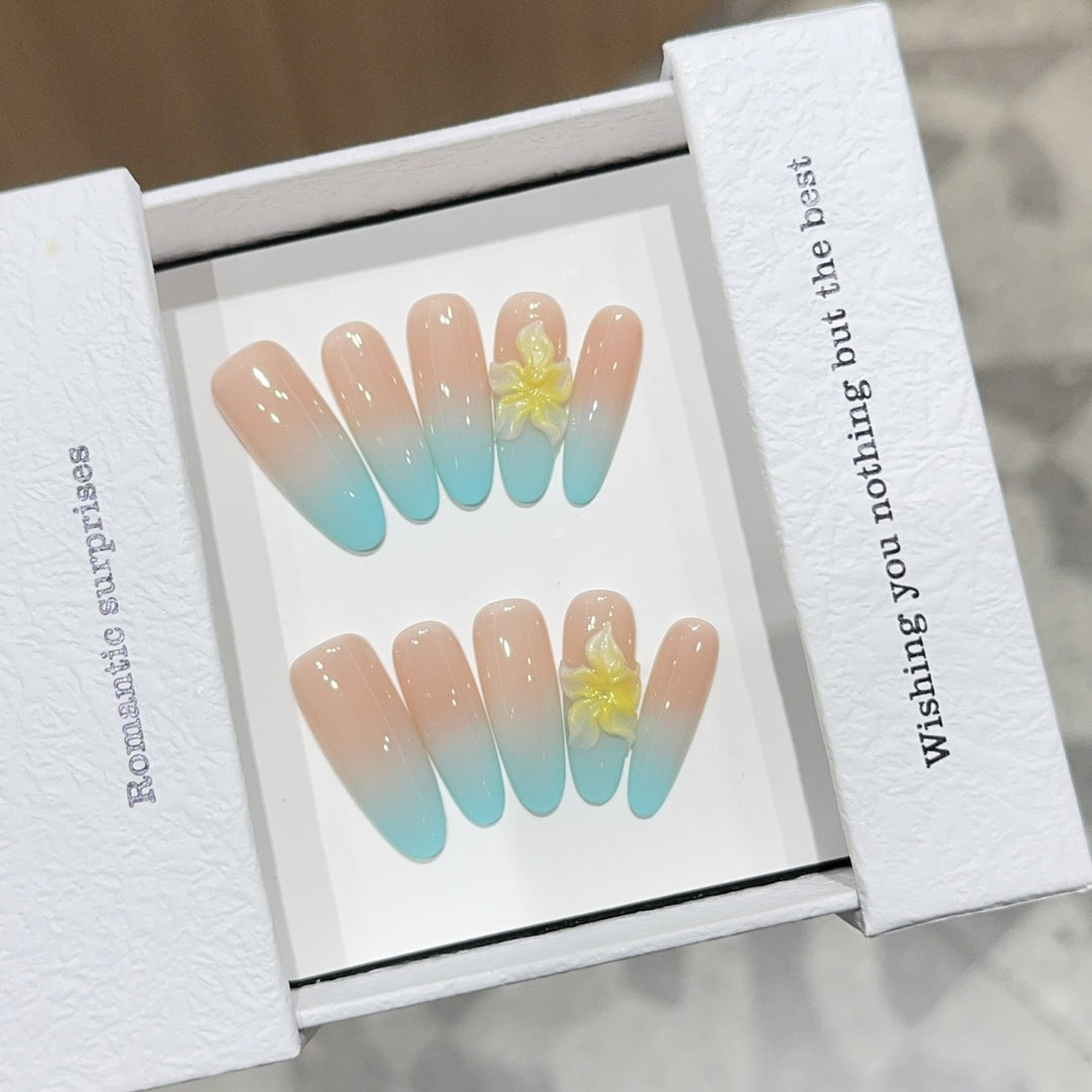 Artificial nails with enchanting ombre effect and floral accents Bowlift