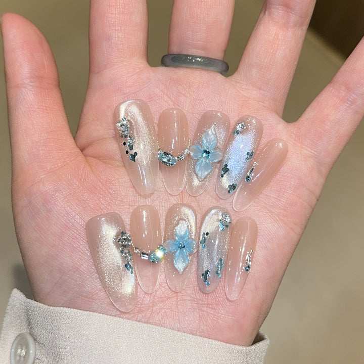 Artificial nails with unique floral design and glitter accents Bowlift