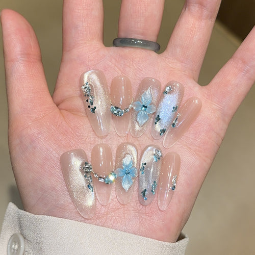 Artificial nails with unique floral design and glitter accents Bowlift