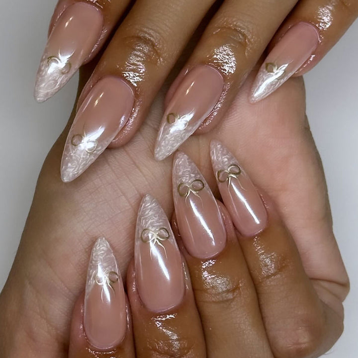 Artful stiletto nails with elegant design and radiant accents Bowlift