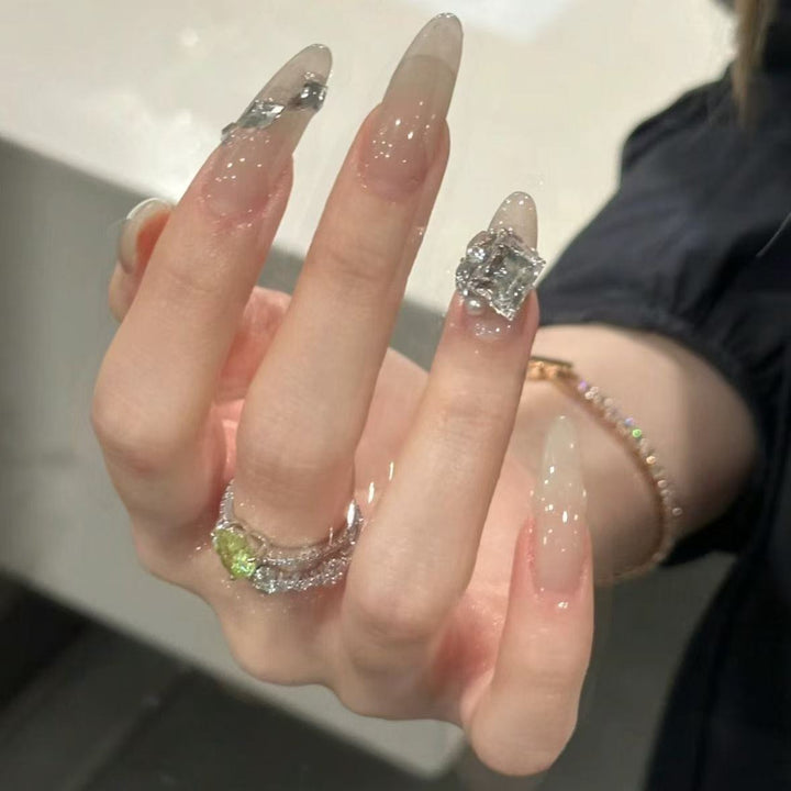 Elegant Stiletto Nail Extensions with Rhinestone Accents Bowlift