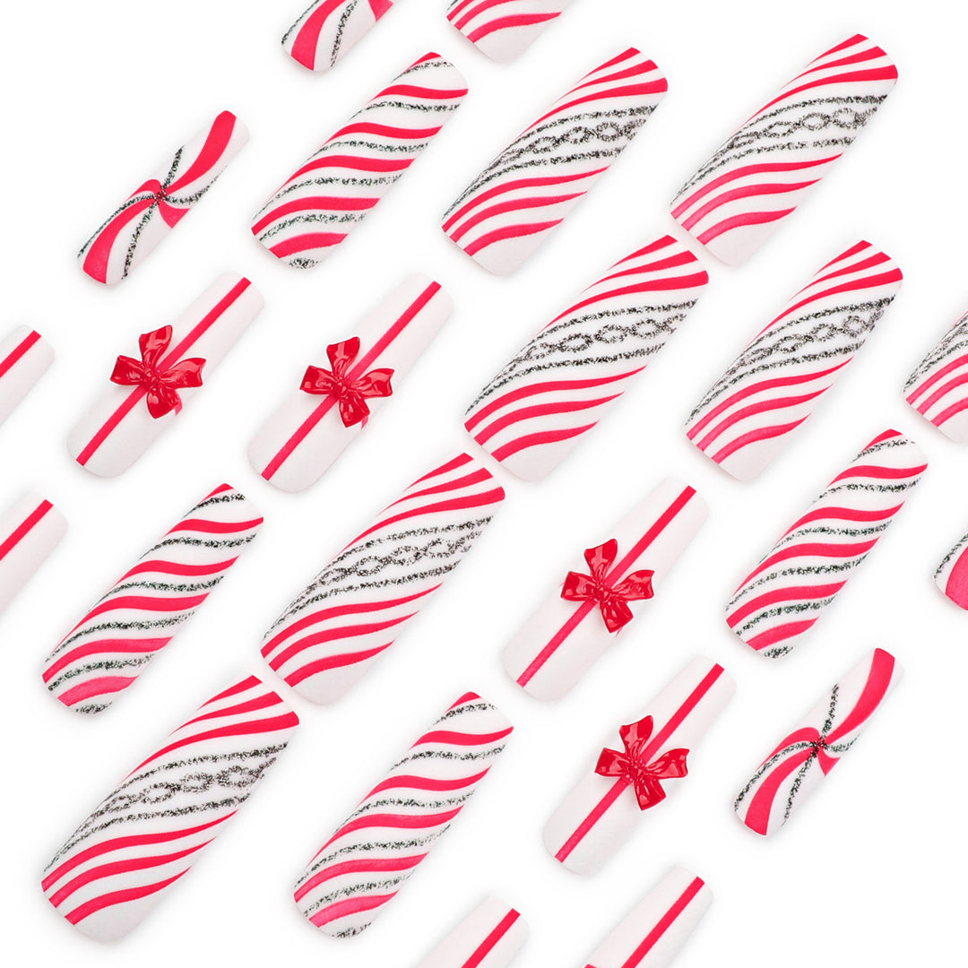Artful Nail Art with Festive Bows and Christmas Motifs Bowlift